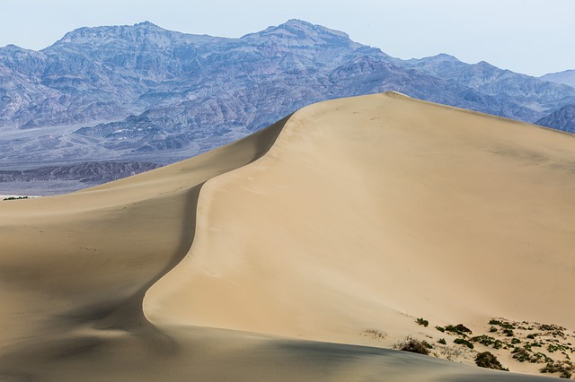 sand-dune-sahara-rugged-rock-mountain